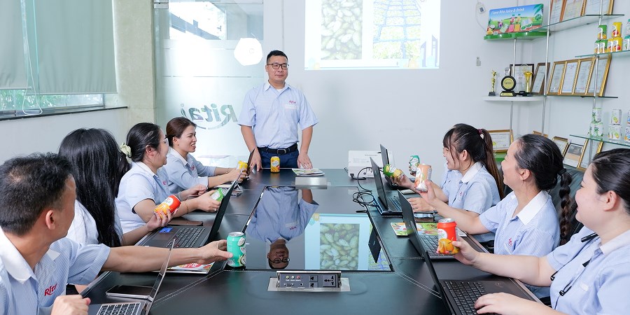 RITA team reviewing product development in a meeting room